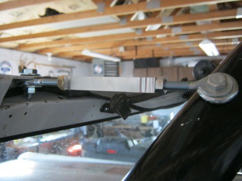 1970 Ford Bronco - Close-up of a turnbuckle assembly on a vehicle's windshield frame.