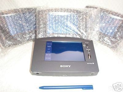 1998 Mercury Sable - A Sony portable display unit is shown with a stylus and two other wrapped screens in the background.