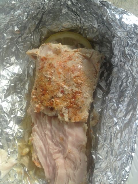 1991 Ford Bronco - Food item wrapped in aluminum foil with a slice of lemon on top.