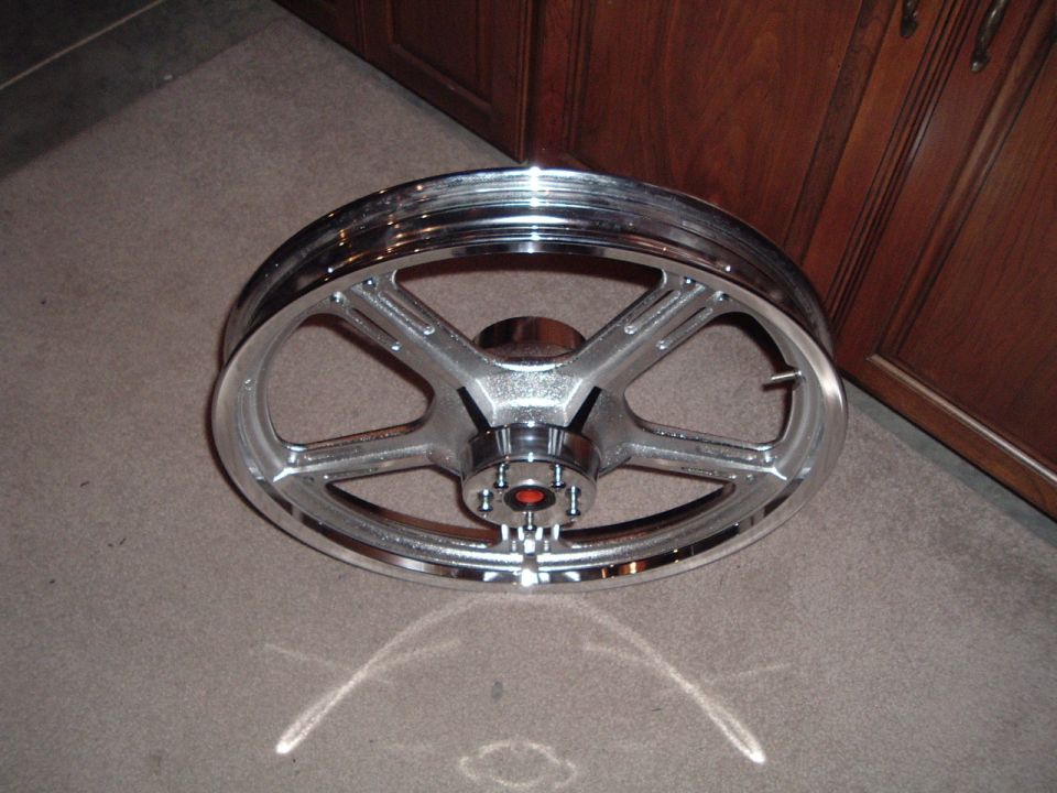 Chrome motorcycle wheel with five spokes