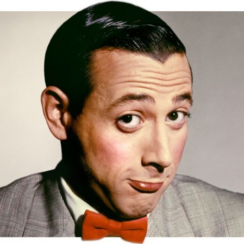 2006 Ford E350 - Portrait of a man with distinctive hairstyle and a red bowtie, against a neutral background.