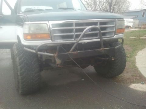 1994 Ford Bronco - Front view of a 1992 Ford Bronco with a custom bumper and off-road tires.