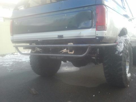 1994 Ford Bronco - This Ford Bronco has a custom rear bumper and large off-road tires, suggesting it's built for terrain.