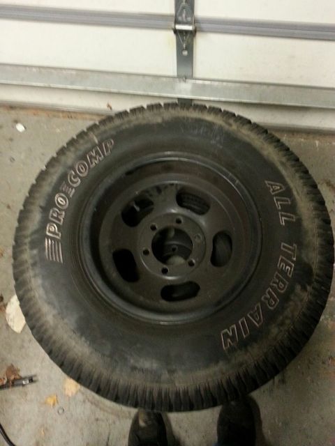 1987 Toyota 4Runner - A black all-terrain tire with "PRO COMP" and "ALL TERRAIN" branding is shown.