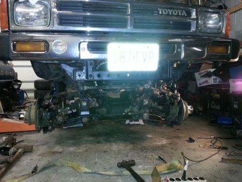 1987 Toyota 4Runner - The front end of a 1987 Toyota 4Runner is shown with its suspension system disassembled.