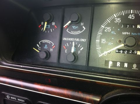 1990 Ford F-150 - Dashboard gauges for a 1990 Ford F-150, including fuel, oil, temperature, and speedometer readings.