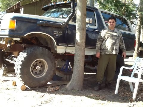 1989 Ford Bronco - This modified 1989 Ford Bronco features a snorkel and oversized tires, suggesting off-road capabilities.