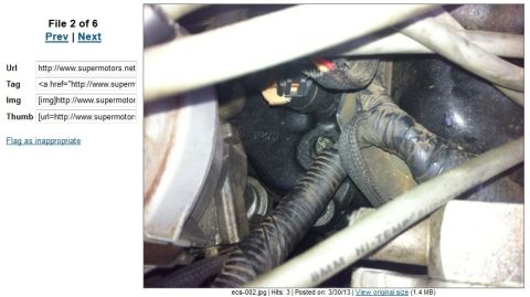 1994 Ford Bronco - A detailed view of the wiring harness and connectors within an engine bay, showing various cables and electrical components.