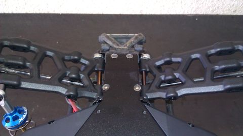 1996 Ford Bronco - Close-up view of an RC car's front suspension assembly, showing the A-arms and shock components.