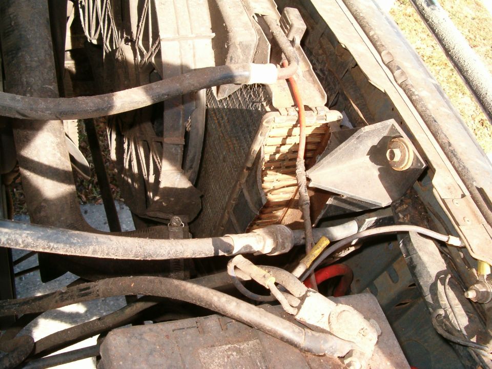 Engine bay with damaged radiator and hoses