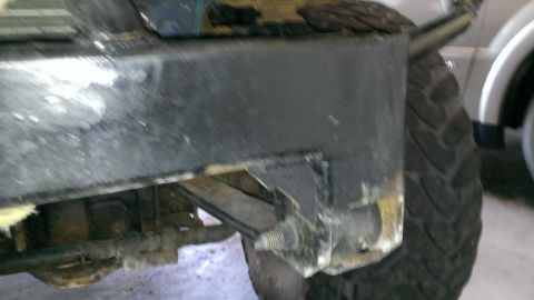 1994 Ford Bronco - Close-up of the rear of a 1994 Ford Bronco, showing the tire and suspension components.