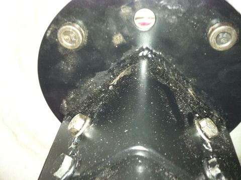1992 Ford C-350 (Centurion Conversions) - Close-up view of a black metal bracket, possibly part of a vehicle's undercarriage, with a Supermotors.net watermark visible.