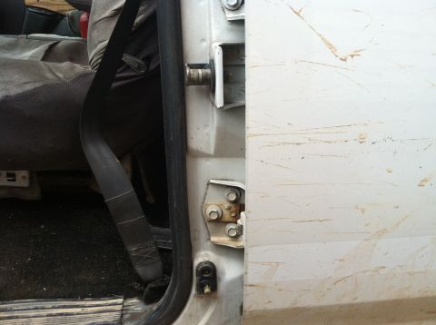 1992 Ford C-350 (Centurion Conversions) - Close-up of a truck's interior door frame, seatbelt, and seat, with a Supermotors.net watermark.