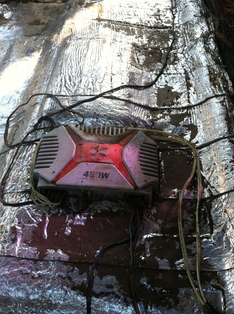 1992 Ford C-350 (Centurion Conversions) - A car amplifier with 480W power rating is visible, wired and attached to silver insulation material.