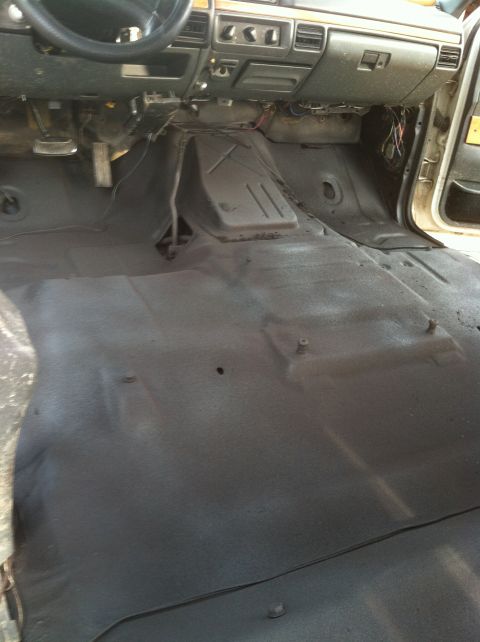 1992 Ford C-350 (Centurion Conversions) - The interior of a truck shows a bare floor and dashboard, suggesting a restoration or repair project.