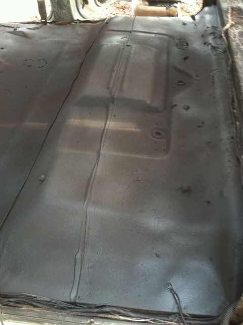 1992 Ford C-350 (Centurion Conversions) - Interior floor of a vehicle, showing metal with some texture and a seam.