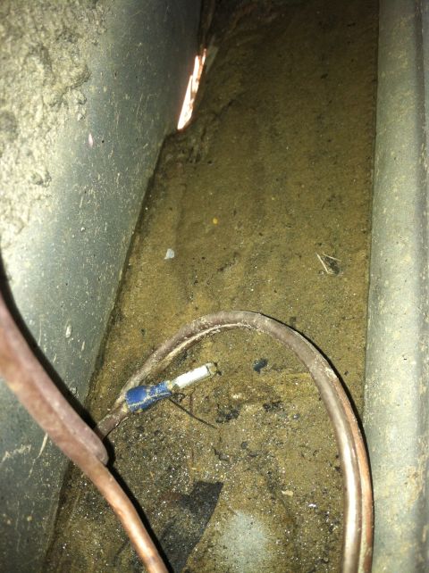 1992 Ford C-350 (Centurion Conversions) - This image shows wiring and debris within a dirty compartment, possibly from a vehicle's undercarriage or engine bay.