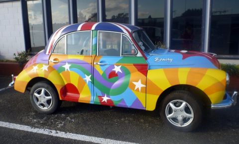 1969 MINI Cooper - This car has a vibrant, custom paint job a rainbow, stars, and a Union Jack roof.