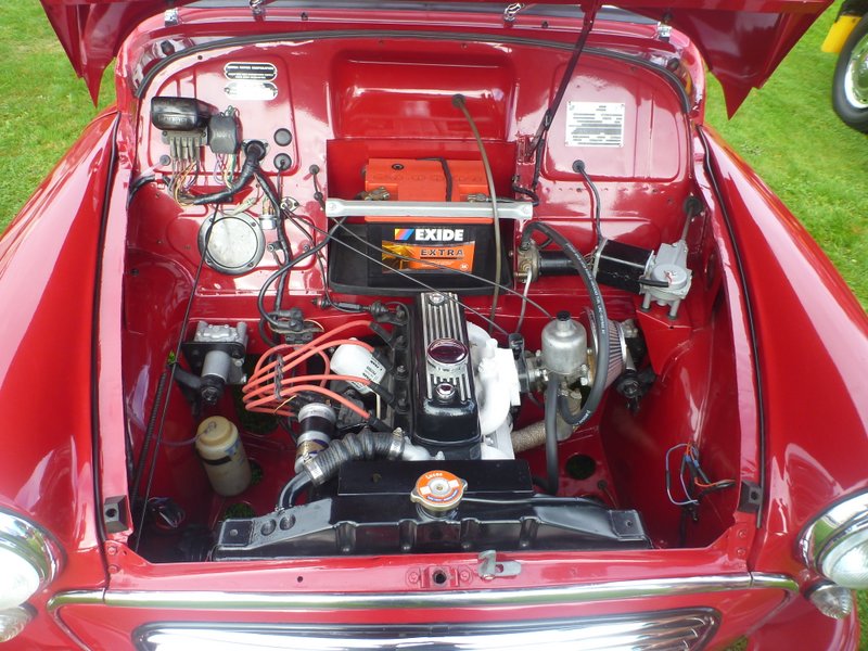 1969 MINI Cooper engine bay with EXIDE battery and visible engine components