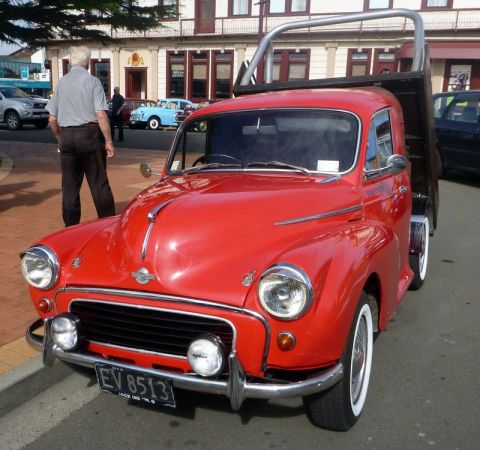 1969 MINI Cooper - This red pickup truck, possibly a Morris Minor, is seen from the front.
