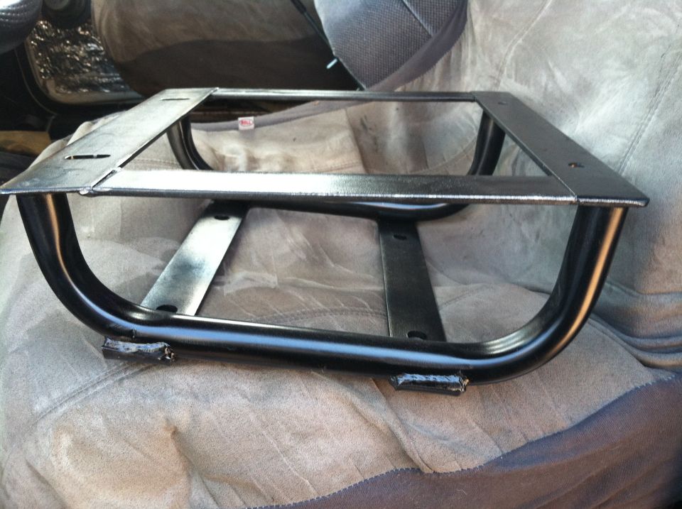 Metal seat mounting bracket on a seat cover