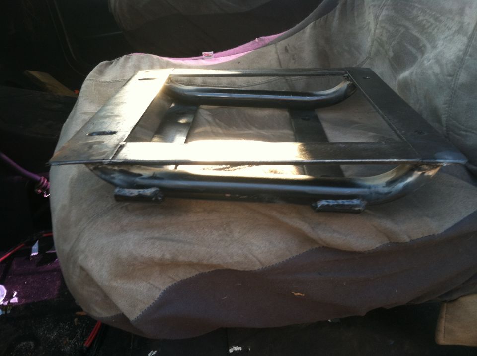 Metal seat frame on a blanket inside a vehicle