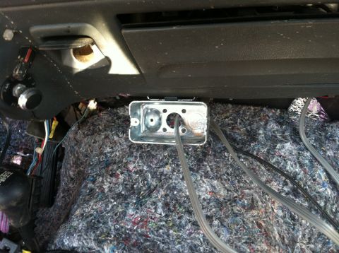 1992 Ford C-350 (Centurion Conversions) - This image shows the interior of a vehicle with exposed wiring and a metal electrical box installed beneath the dashboard.
