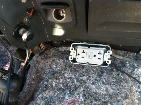1992 Ford C-350 (Centurion Conversions) - Exposed wiring and a new electrical outlet are visible inside the vehicle's interior.