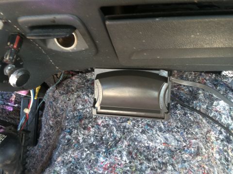 1992 Ford C-350 (Centurion Conversions) - Exposed wiring and insulation are visible under the dashboard of a vehicle.