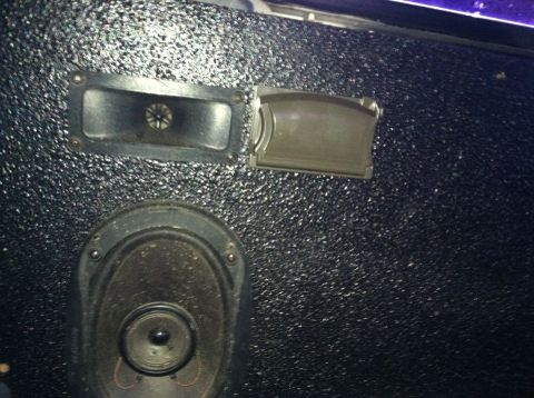 1992 Ford C-350 (Centurion Conversions) - Close-up of a textured interior door panel showing a speaker and a door handle.