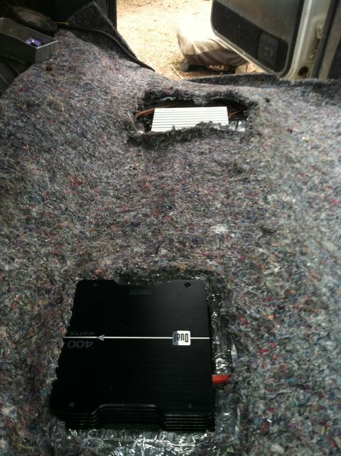 1992 Ford C-350 (Centurion Conversions) - Two audio amplifiers are visible after the carpet has been removed from the interior of this vehicle.