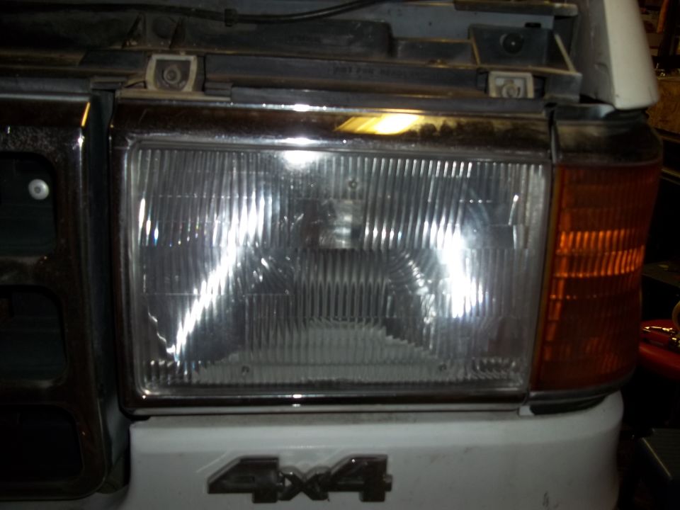 1990 Ford Bronco headlight and 4x4 badge