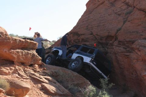 1994 Ford Bronco - This 1994 Ford Bronco tackles a challenging off-road trail, demonstrating its capability on terrain.