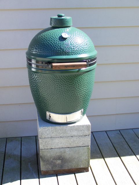 1988 Suzuki Samurai - A Big Green Egg grill sits on a pedestal outdoors, with a thermometer visible on top.