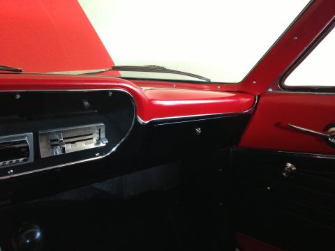 1964 Ford Fairlane - Interior view of a 1964 Ford Fairlane, highlighting the dashboard and door panel details.