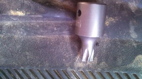 1979 Ford Bronco - A Torx bit socket is shown on a textured surface, possibly a truck bed liner.