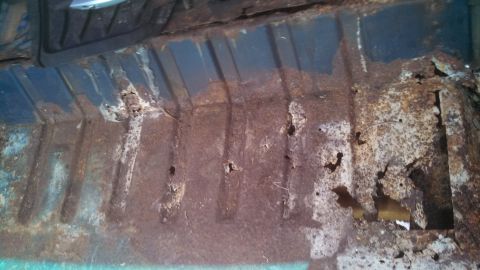 1979 Ford Bronco - The interior floor pan of this vehicle is heavily corroded and shows significant rust damage.
