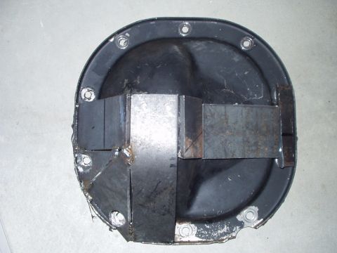 1993 Ford Bronco - A black differential cover with welded metal bracing is shown from an overhead perspective.