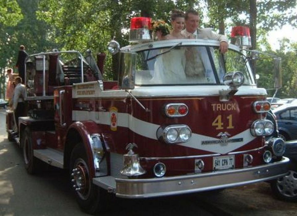 Fire truck with wedding couple in cab, "TRUCK 41" visible