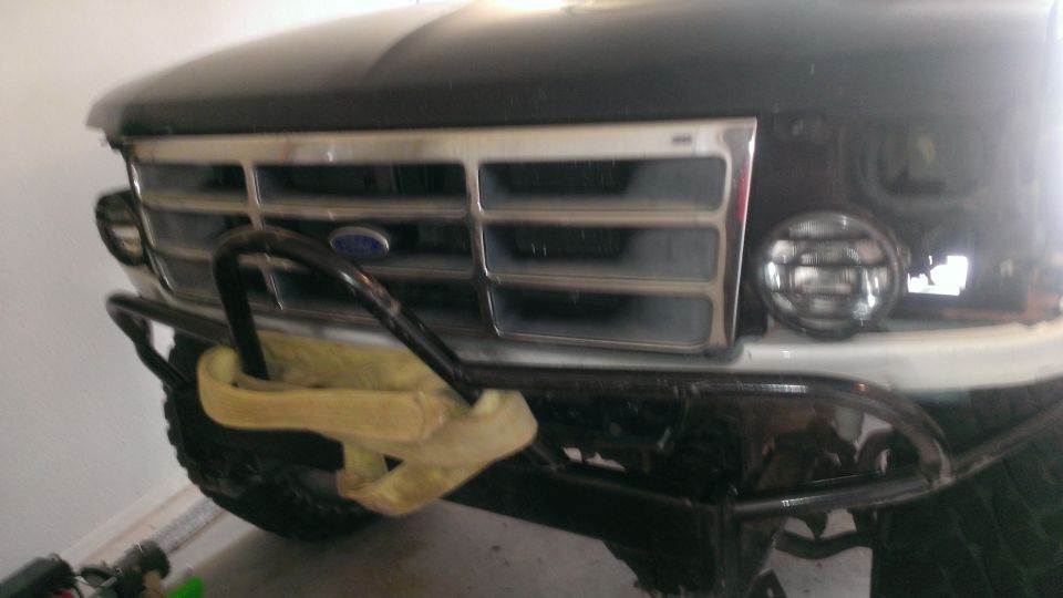 1992 Ford Bronco front end with chrome grille, brush guard, and fog lights
