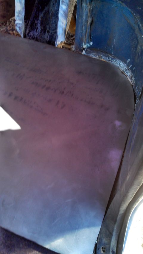 1979 Ford Bronco - Detail shot of a purple fender next to a blue fender, with visible wear and tear.
