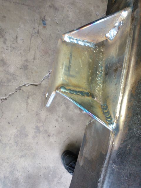 1968 Ford Bronco - This photo shows a custom-fabricated metal bracket with fresh welds, likely part of a vehicle modification project.