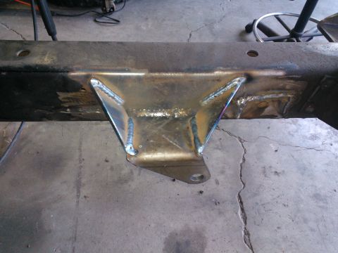 1968 Ford Bronco - A close-up view shows a newly welded bracket on a vehicle's frame, indicating custom modifications.