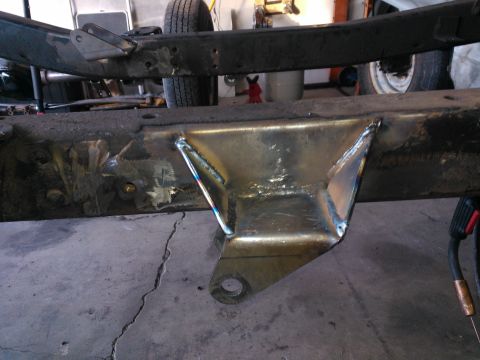 1968 Ford Bronco - Custom welded brackets on a vehicle frame, with a tire visible in the background.