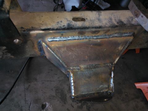 1968 Ford Bronco - Close-up of a custom-welded metal bracket attached to a vehicle's frame, likely part of a modification or repair.