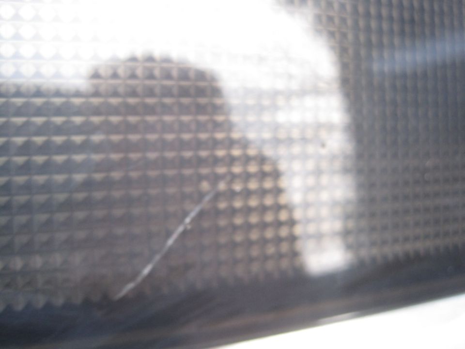 Close-up of a textured surface with a scratch and a watermark