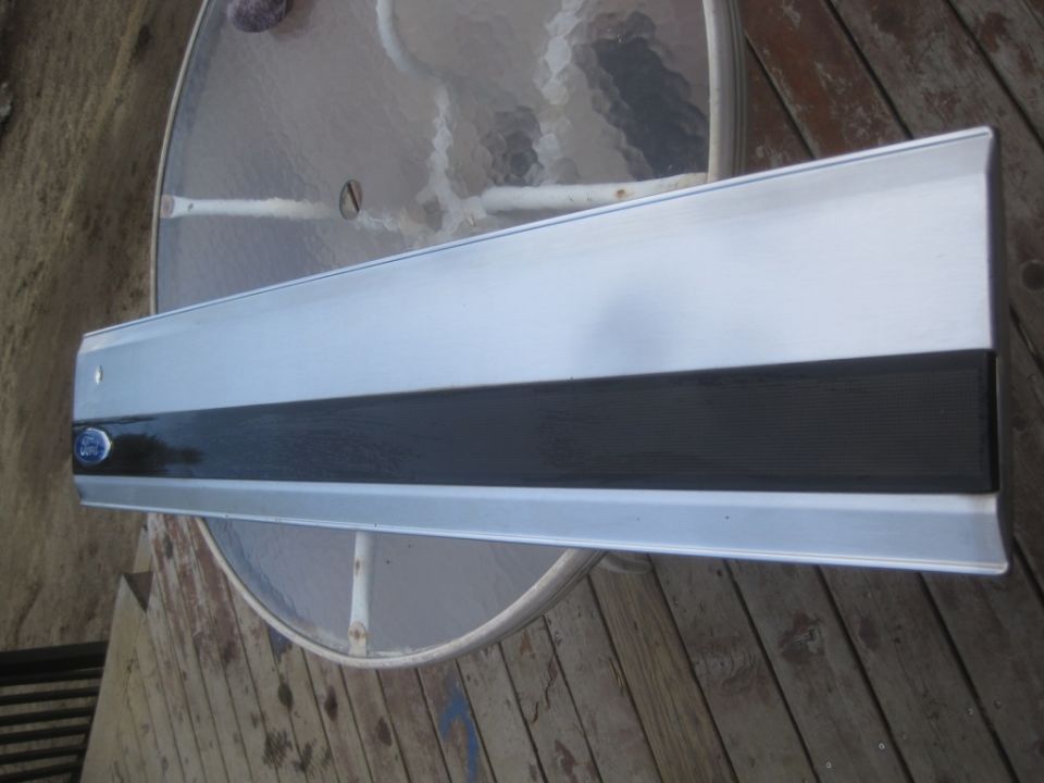 1993 Ford Bronco door trim piece with blue oval Ford logo