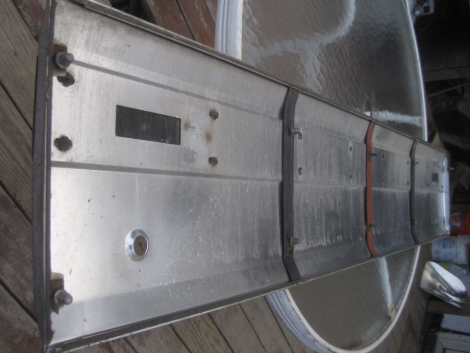 Metal panel with keyhole and rectangular cutouts