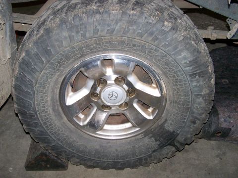 1988 Suzuki Samurai - Close-up of a wheel a Toyota logo, suggesting it is not a 1988 Suzuki Samurai.