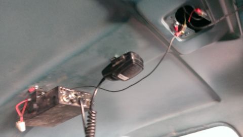 1994 Ford Bronco - CB radio and microphone installed on the interior ceiling of the vehicle.